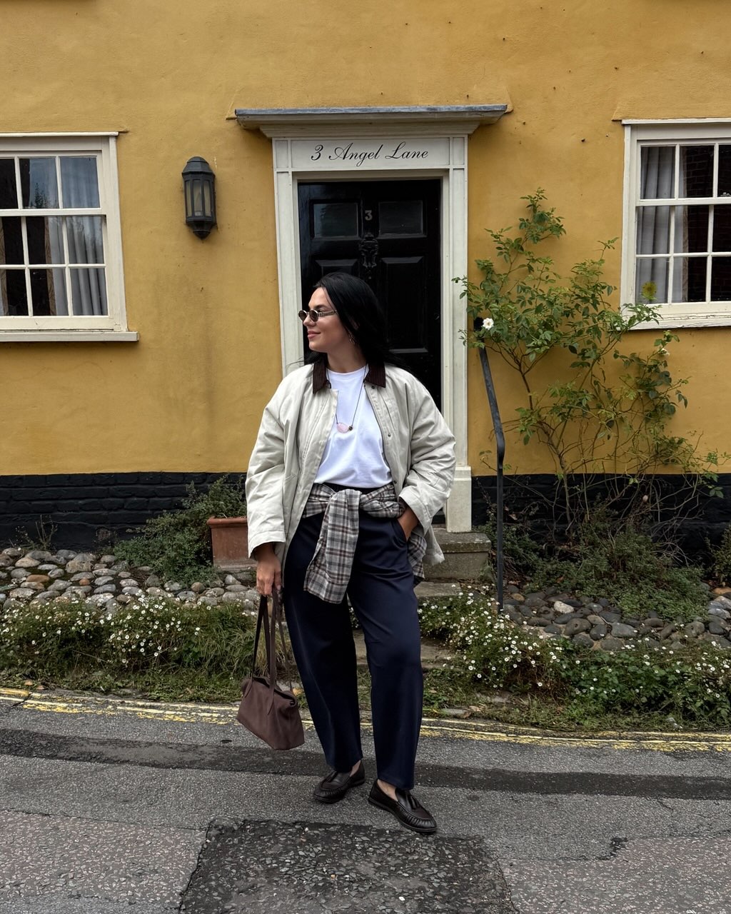 Claudia wearing navy trousers