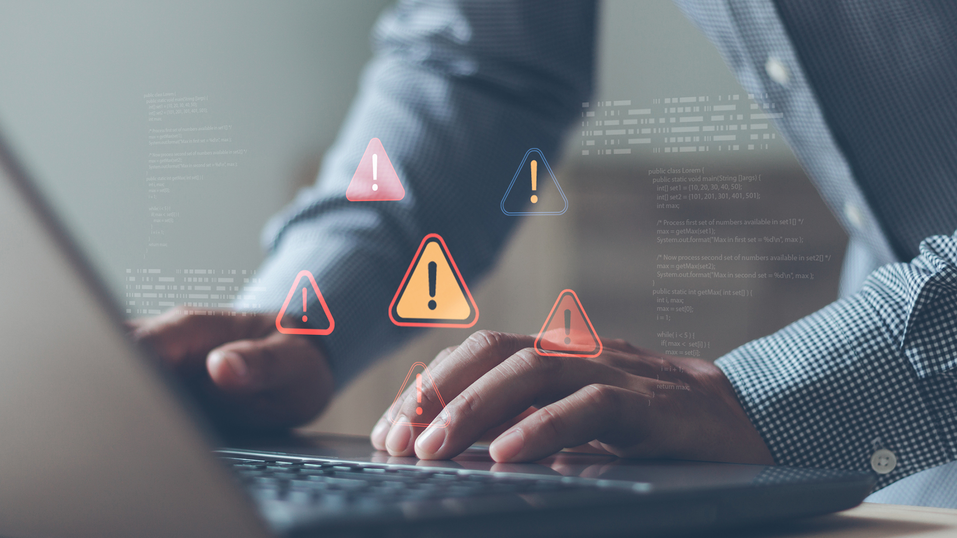 A businessperson's hands using a laptop, with overlaid red and yellow, holographic warning symbols indicating a cyber scam and fraud.