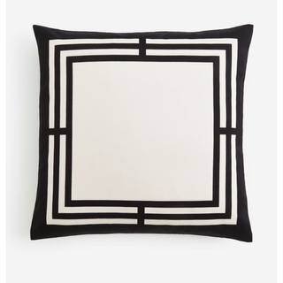 white pillow with black border pattern