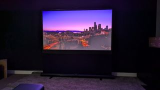 JMGO N1S Pro 4K with city landscape on screen