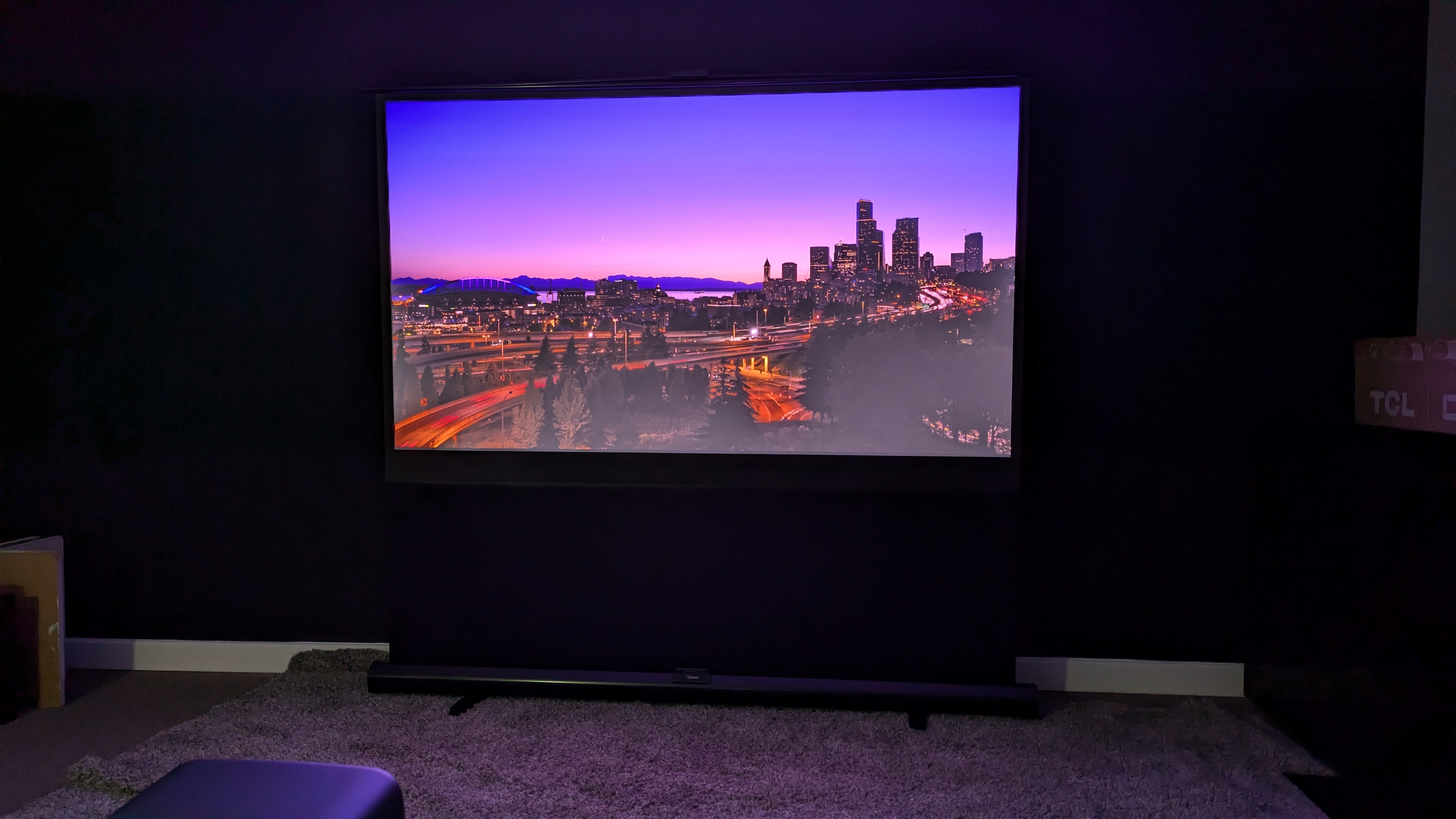 JMGO N1S Pro 4K with city landscape on screen