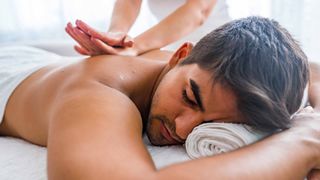 Man receiving lymphatic release massage