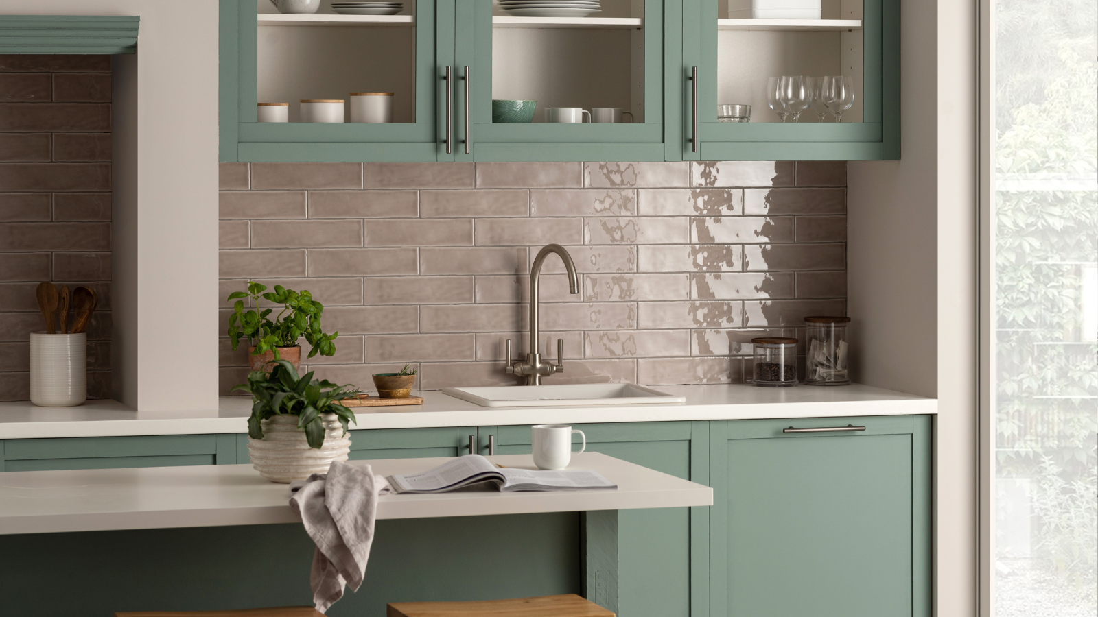Green kitchen with pink tiles