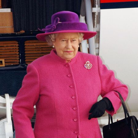 Queen Elizabeth traveling by plane.