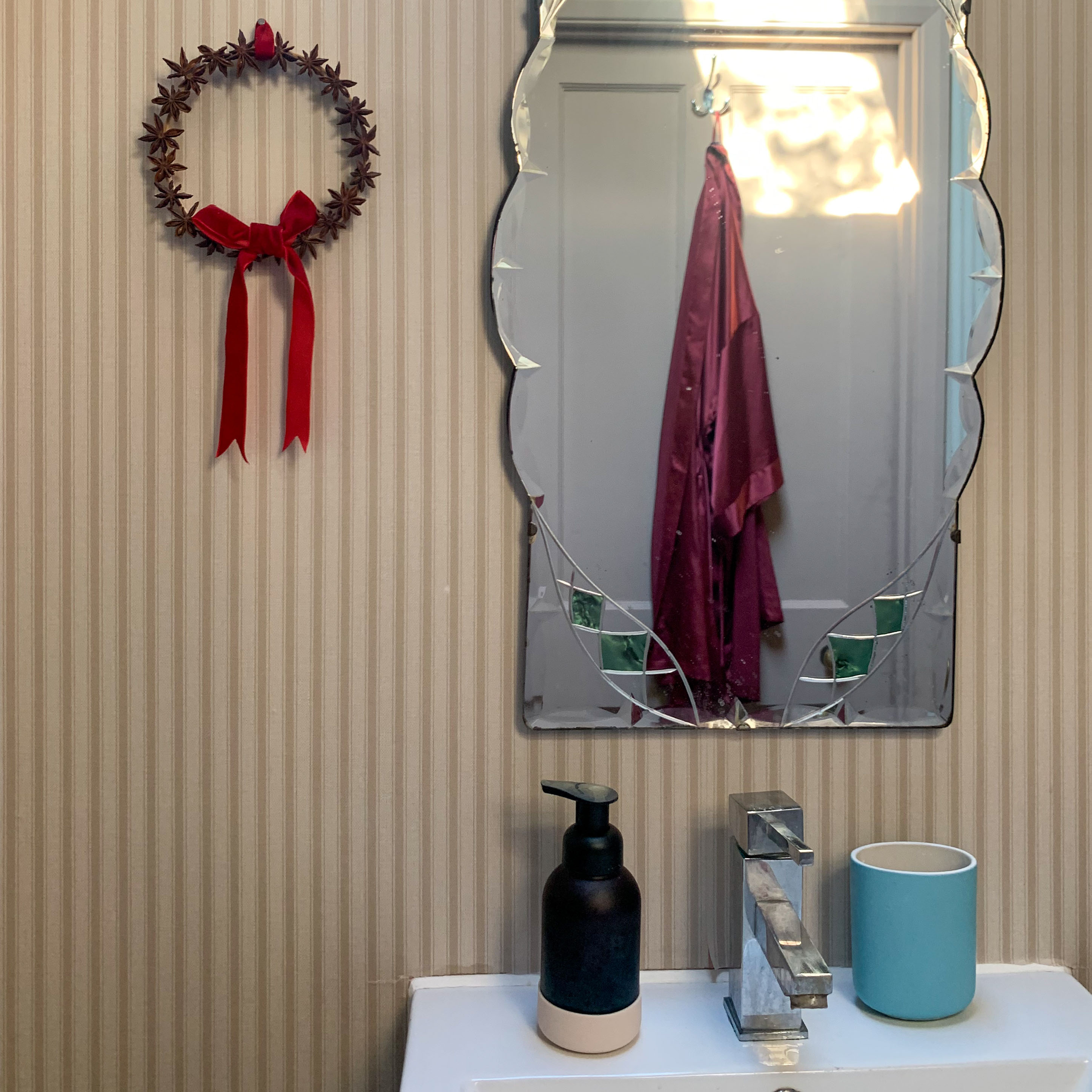 bathroom with striped wallpaper