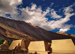 An exterior shot of three temples in the valley at Tabo