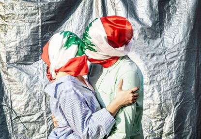 Omar Sfeir's photograph which sees two lovers embracing, their heads wrapped in the Lebanese flag 