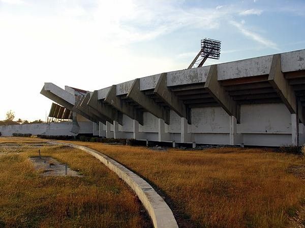 Overgrown approach to stadium.