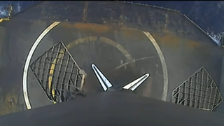 view looking down a rocket to a target on a ship
