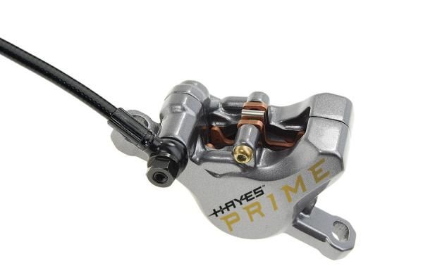 The two-piece caliper boasts increased stiffness for better power and lever feel plus top-loading pads that are easier to replace and more secure. The larger caliper window improves airflow, too.