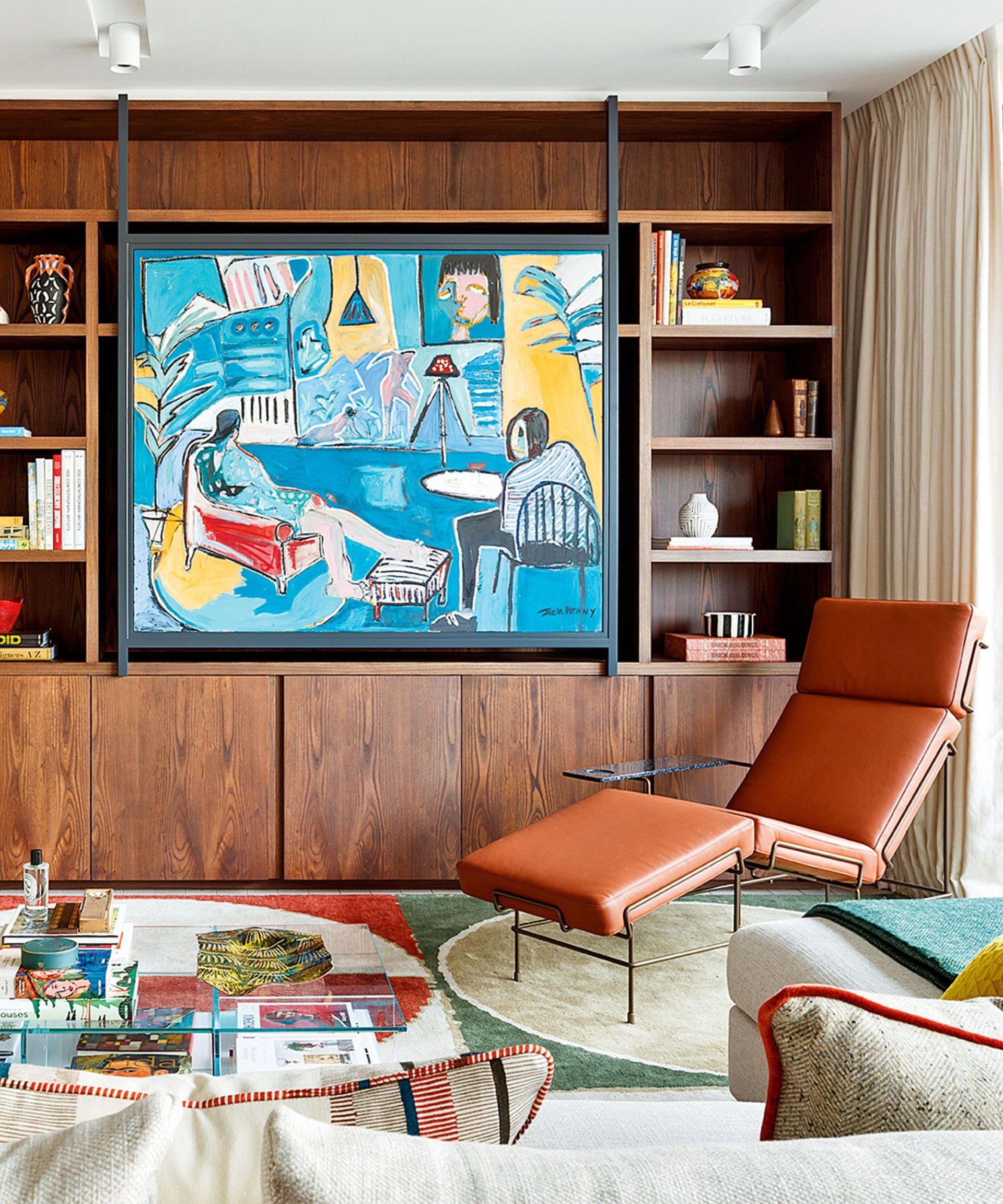 Storage hidden behind artwork in a living room