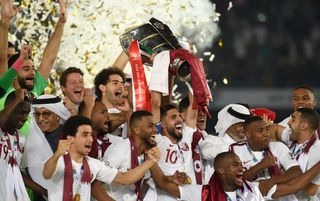 Qatar players celebrate winning the Asian Cup