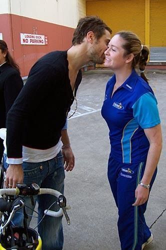 Ben Kersten greets fellow cyclist Kate Nichols as they arrive for the press conference.