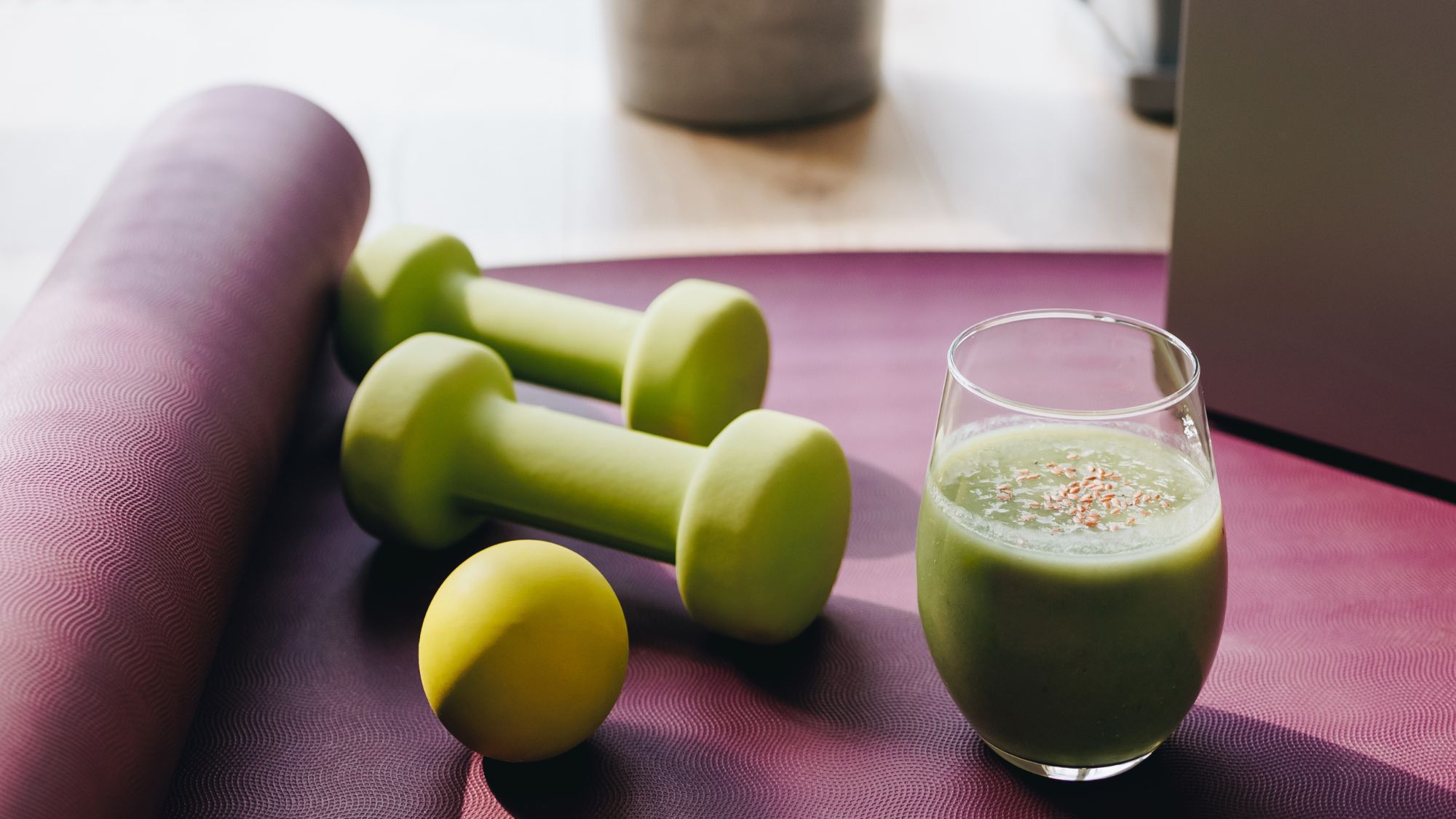 Wellness deals: a mat with weights and a smoothie