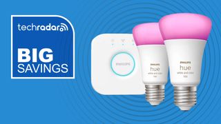Philips Hue light bulbs and Hue Bridge on blue background with white text reading 'TechRadar big savings'