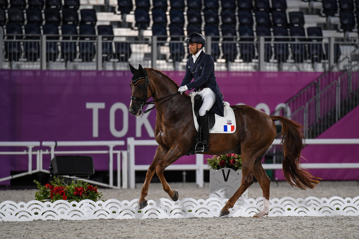 French dressage rider Alexandre Ayache and Zo What compete in the grand prix at the Tokyo Olympics