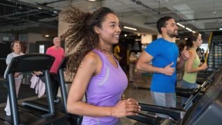 Group of people at the gym running on the treadmills