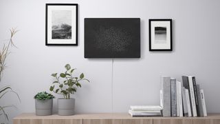 the sonos ikea SYMFONISK picture frame mounted on a wall