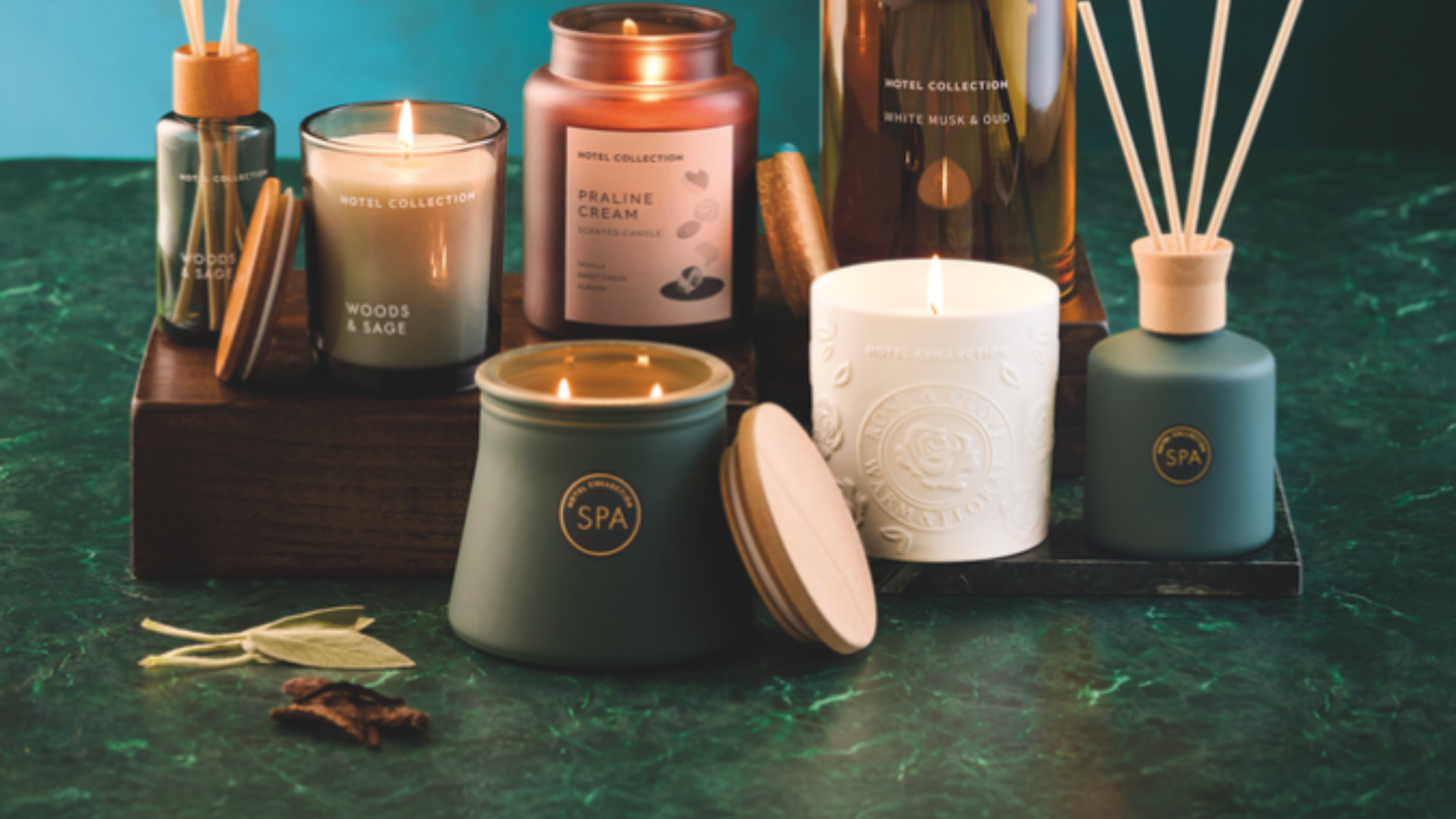 Aldi new candles in a group shop on a jade background