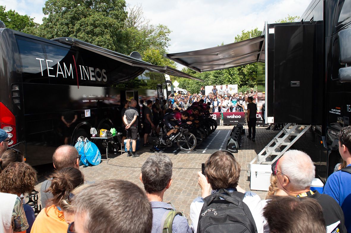 Team Ineos warm up ahead of the stage with large crowds