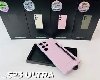 Image of the Samsung Galaxy S23 Ultra in a pink color along with the S Pen in front of other S23 Ultra retail boxes