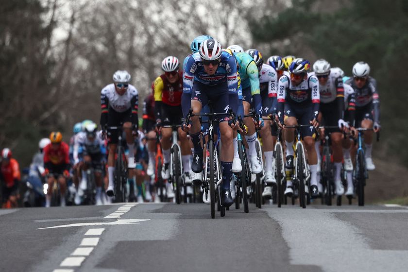 The pack of riders cycles during the 1st stage of the Paris-Nice cycling race, 156,1 km between Le Perray-en-Yvelines and Le Perray-en-Yvelines, on March 9, 2025. (Photo by Anne-Christine POUJOULAT / AFP)