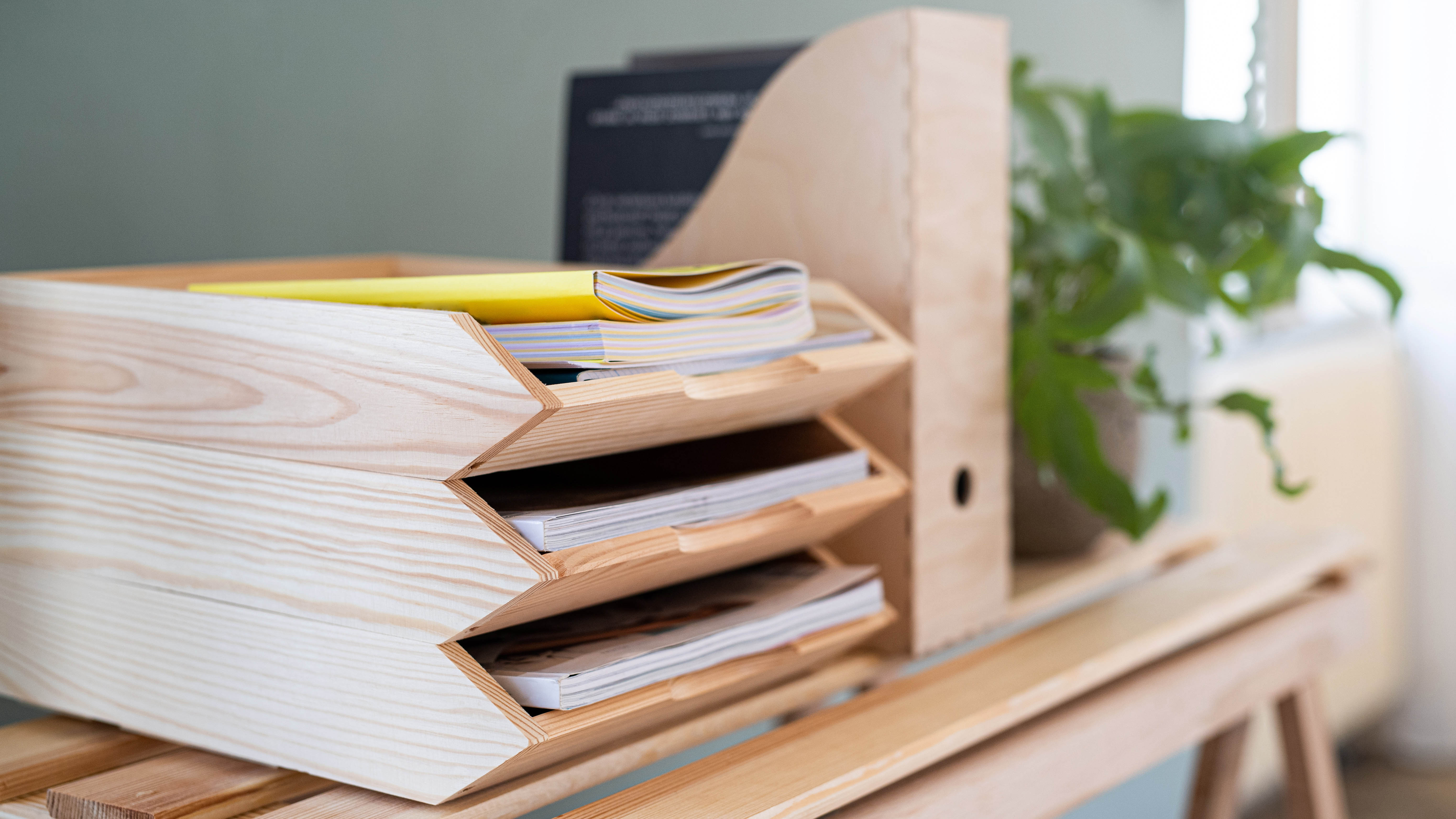 Wooden filing tray with paperwork