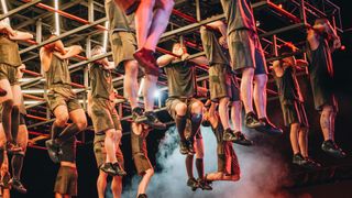 The Physical: 100 cast hanging from monkey bars during a challenge