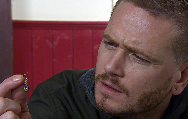David finds one of Maya's earrings on the floor in Emmerdale