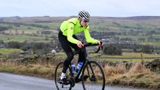 Male cyclist suffering from shoulder pain when cycling