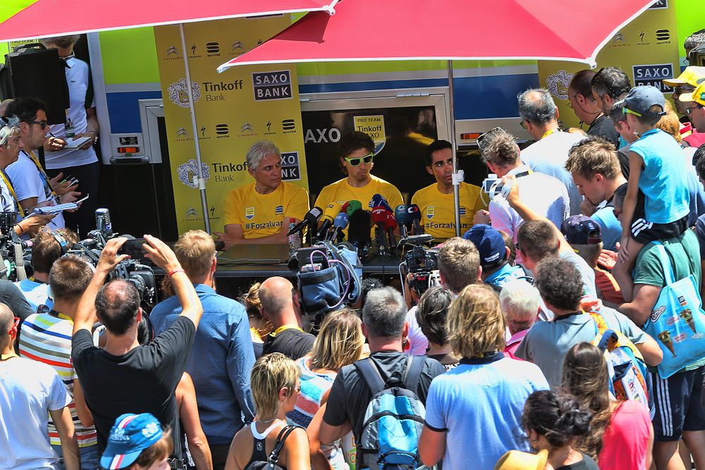 Tinkoff-Saxo are surrounded by media and fans.