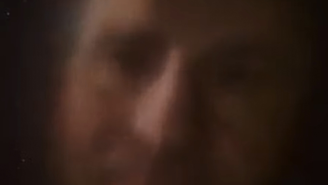 A blurry vision of Douglas Adams In The Hitchhiker's Guide To The Galaxy