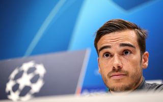 Harry Winks answers questions at a press conference