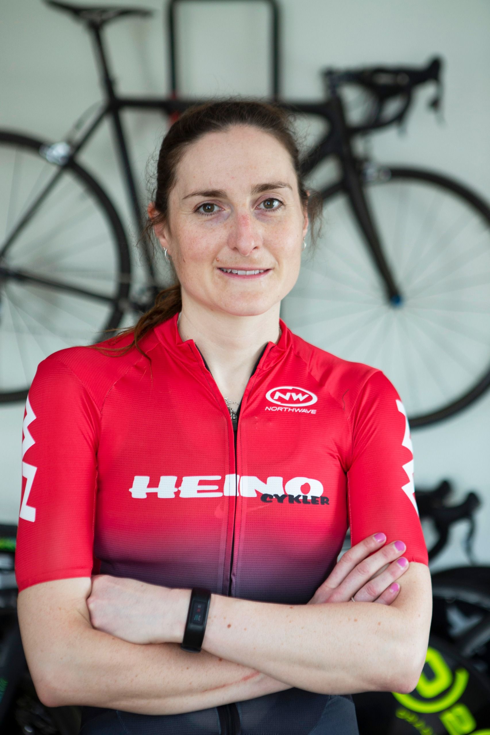 Alice Lethbridge in a red cycling jersey