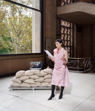 woman holding script