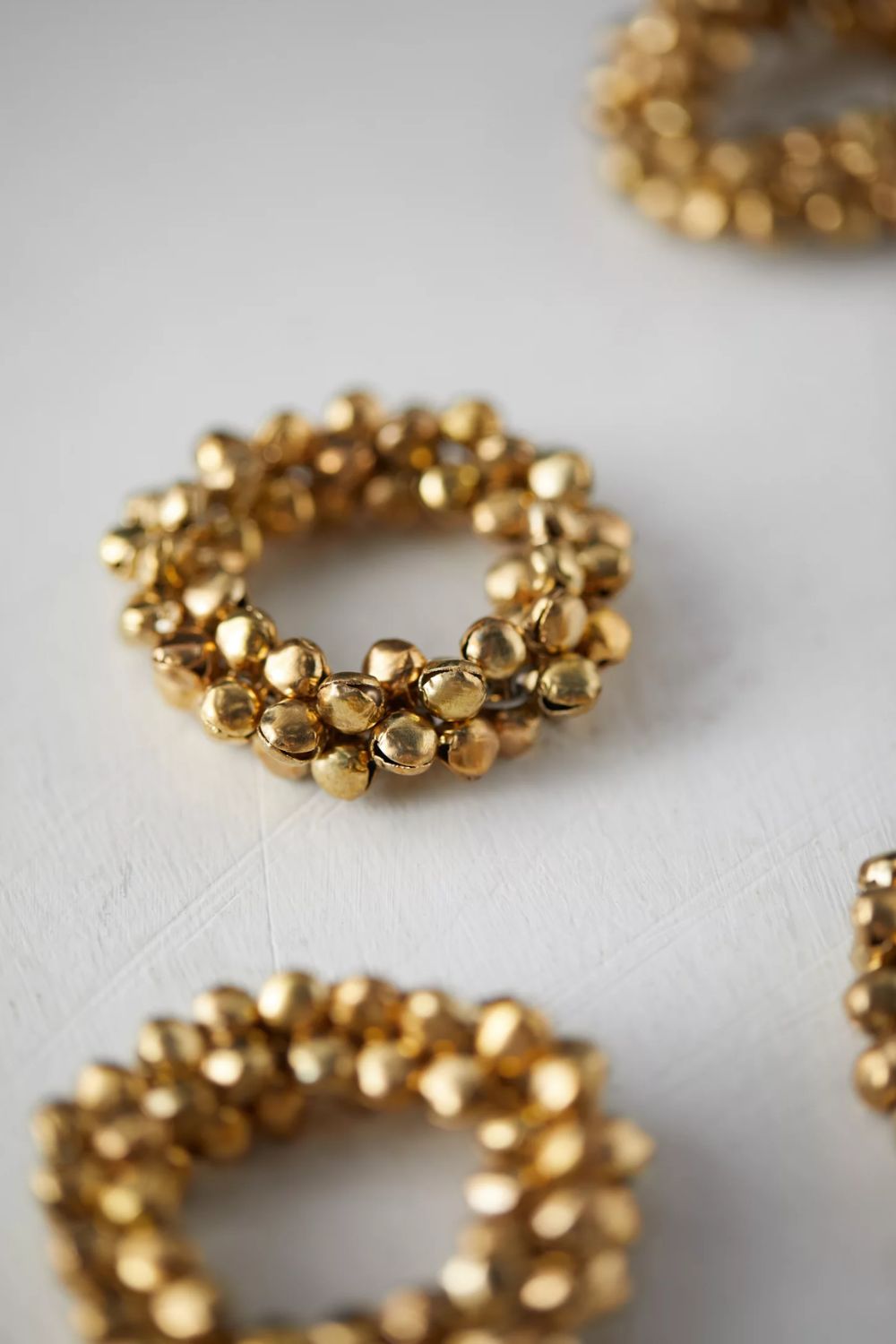 Gold jingle bell napkin rings