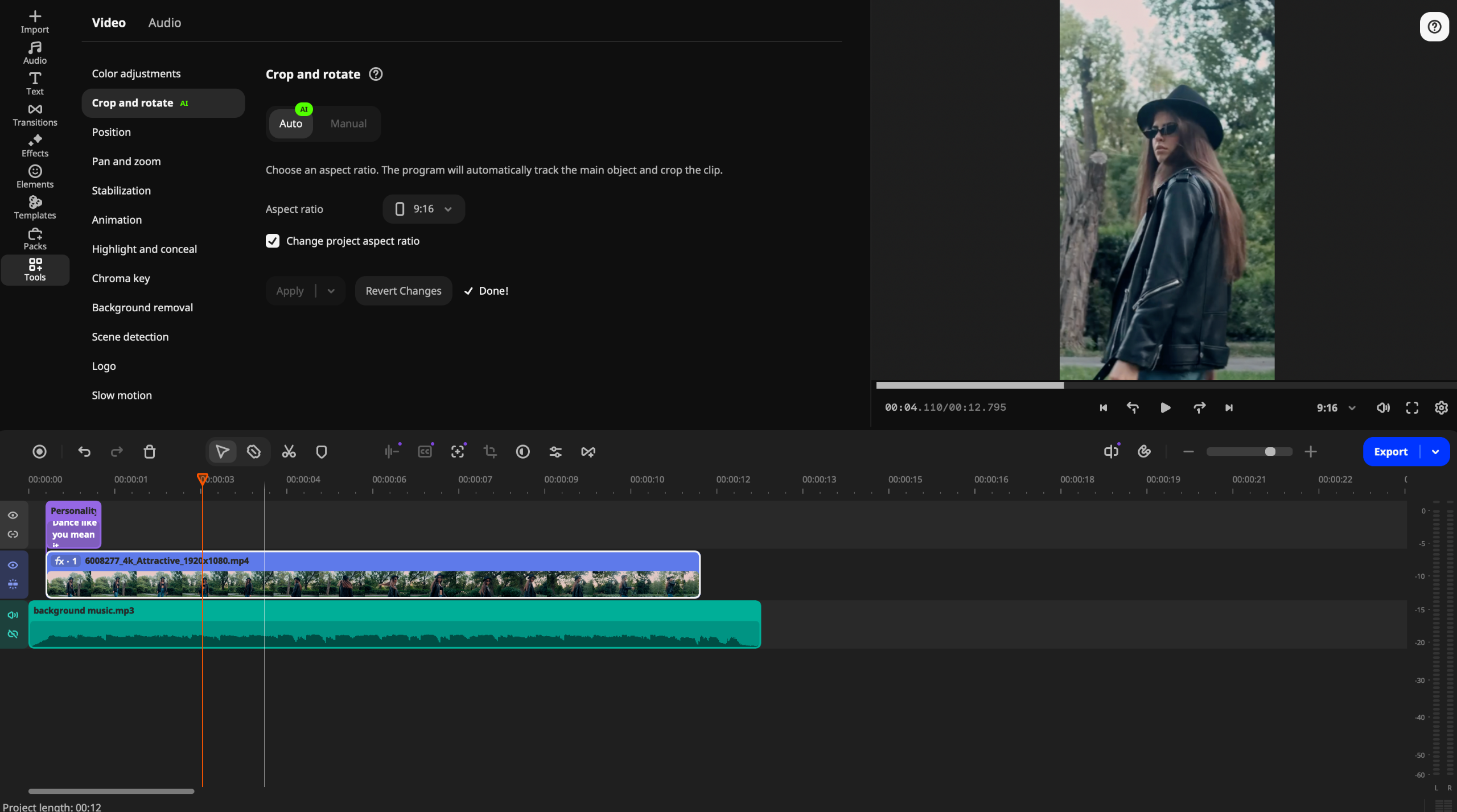 Video editing interface showing a vertical clip of a woman in a black hat and sunglasses outdoors, with timeline and audio track visible