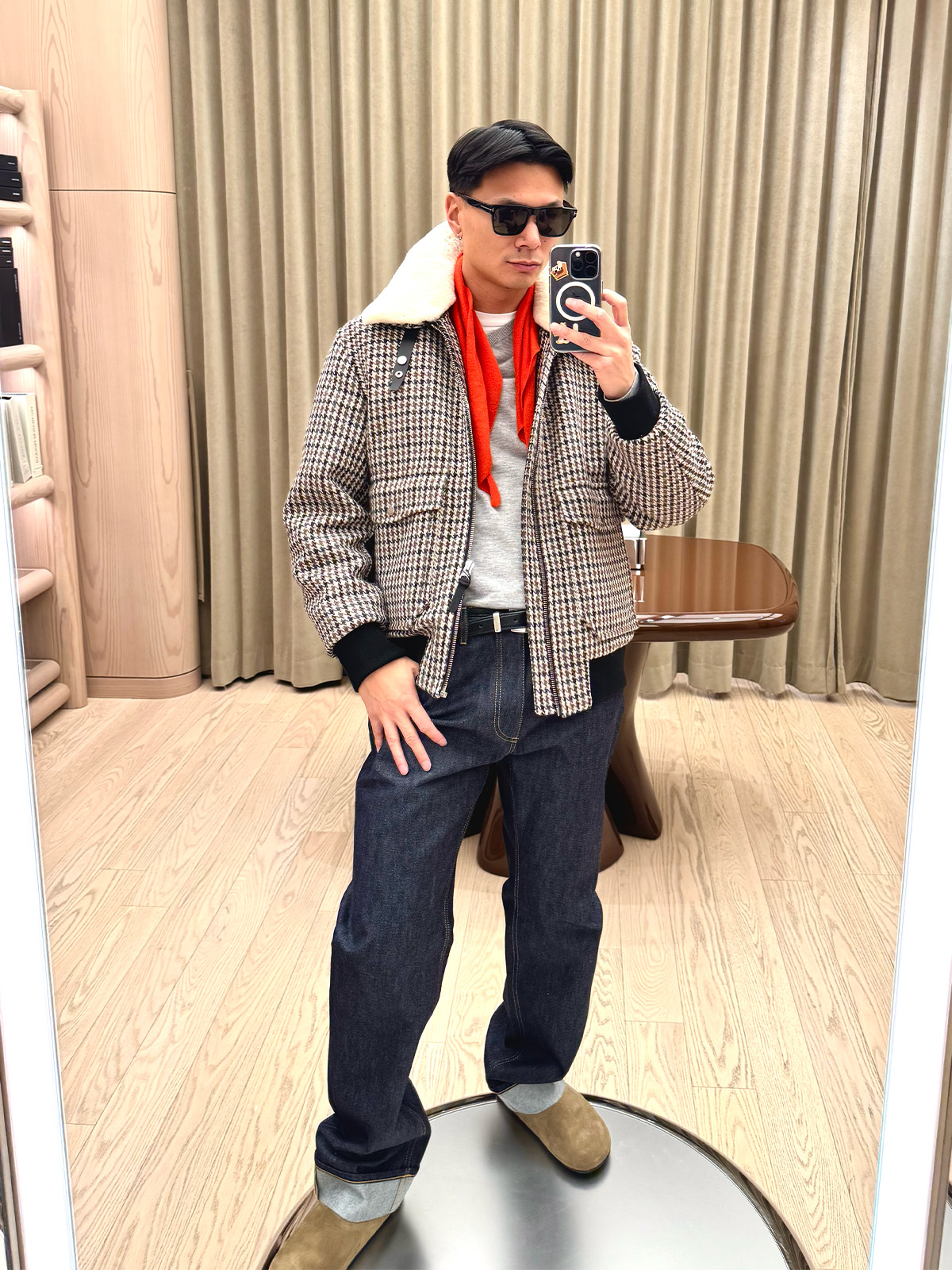 Who What Wear editor in residence Joseph Tang wearing a plaid bomber jacket.