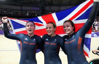 Katy Marchant, Sophie Capewell and Emma Finucane of Team Great Britain celebrate as Gold medal winners during the Women's Team Sprint Finals on day ten of the Olympic Games Paris 2024 