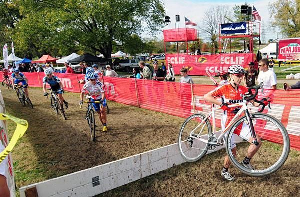 Alison Sydor (Team Maxxis-Rocky Mountain) leads the women over the barriers.