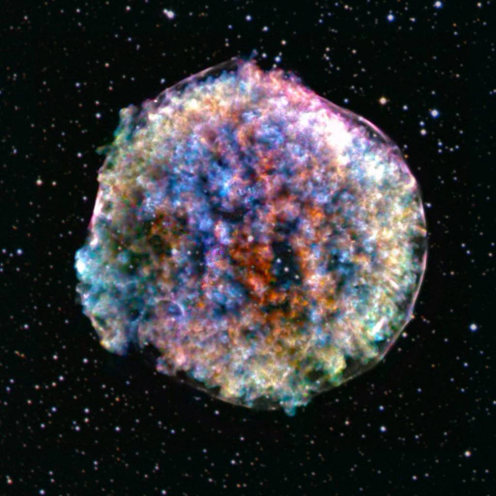 A fuzzy-looking, multicolored orb against the backdrop of space, which is speckled with stars.
