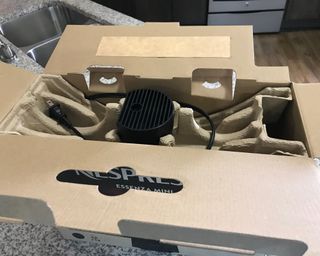 Nespresso Essenza Mini coffee maker in cardboard with molded protective packaging
