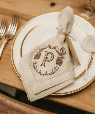 personalized napkin with p initial on wooden dining table