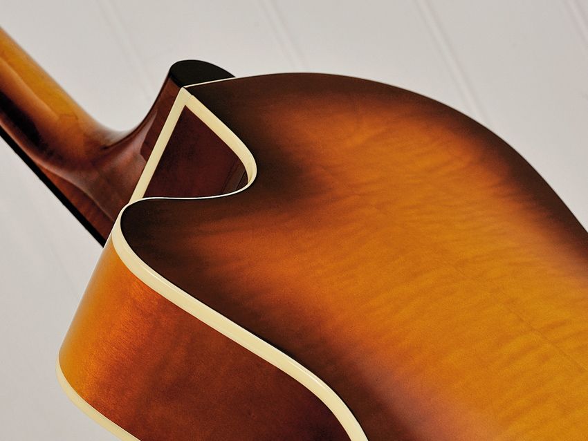 Tidy binding and a beautiful 'burst adorn the guitar's 14th-fret join.