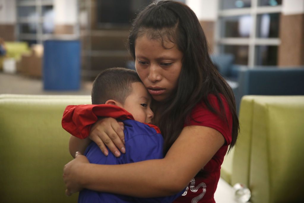 A woman, identified only as Maria, is reunited with her son Franco, 4, at the El Paso International Airport on July 26, 2018 in El Paso, Texas. 