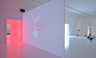In another room, a mobile projector, mounted on a robot, displays the names of real perfumes on the walls