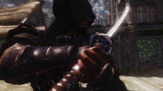 Best Skyrim mods — a hooded Dragonborn brandishes the Dragonbane katana and its mod-improved visuals.