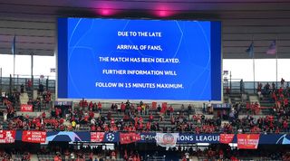 The big screen at the Stade de France announces a delay in the kick-off to the Champions League final between Liverpool and Real Madrid.