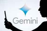 Google Gemini logo with person holding phone