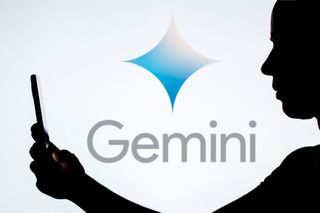 Google Gemini logo with person holding phone